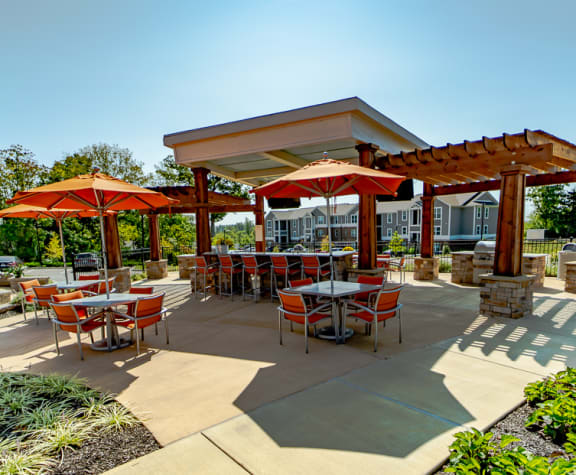 Outdoor Grill With Intimate Seating Area at River Crossing Apartments, St. Charles, Missouri