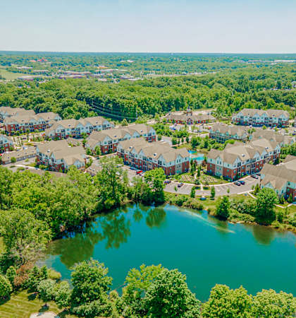 an aerial view of a community with a body of water
