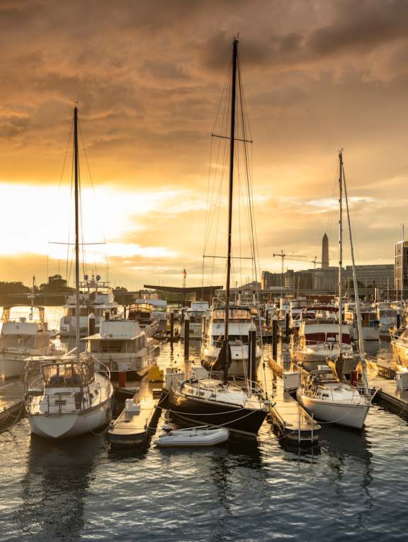 A marina filled with boats at sunset at Artline Apartments, Washington, DC, 20024