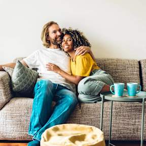 a man and a woman sitting on a couch