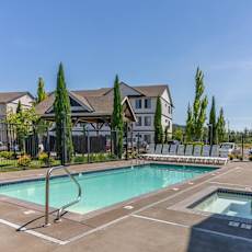 A swimming pool and hot tub in a residential area at Timberridge Place Apartment Homes, Albany, 97322