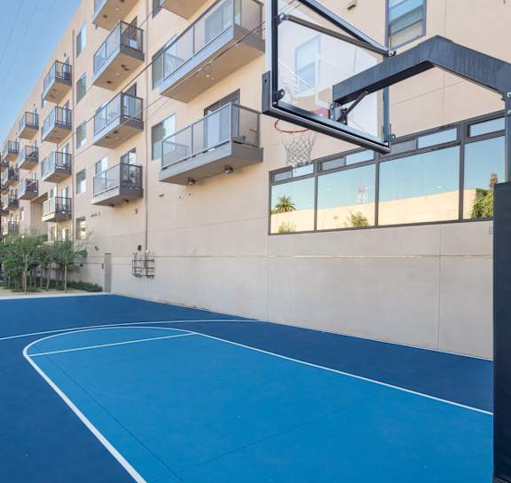A basketball court is located on the balcony of an apartment building at Wilshire Valencia Apartment, California