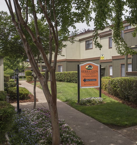 Sierra Glen leasing office sign and pathway to leasing office 