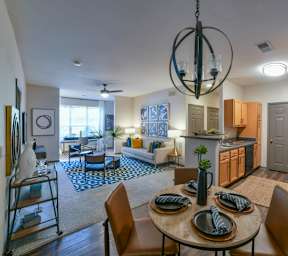 a living room with a dining room table and a kitchen at Parc 1346, Chattanooga, Tennessee