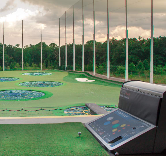 a view of the driving range at top golf