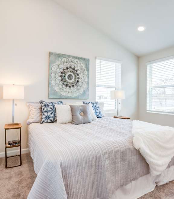 Bedroom with a Large White Bed at Refinery Row in Baltimore, MD 21224