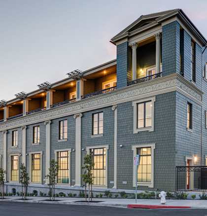 A modern building with a mix of blue and grey tones.