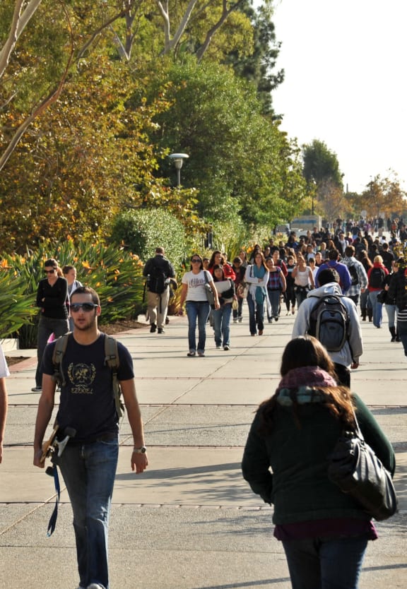 Students walking at SDSU around Pointe Luxe Apartments in San Diego, CA