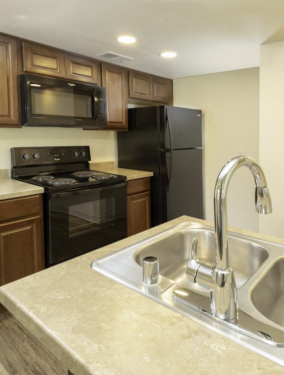 Kitchen with Island at River Oaks Apartments Hanford, CA