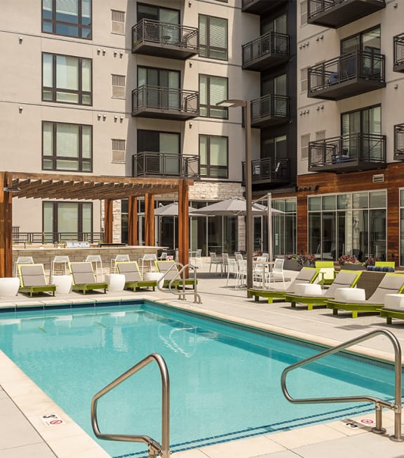 a swimming pool in the middle of an apartment building