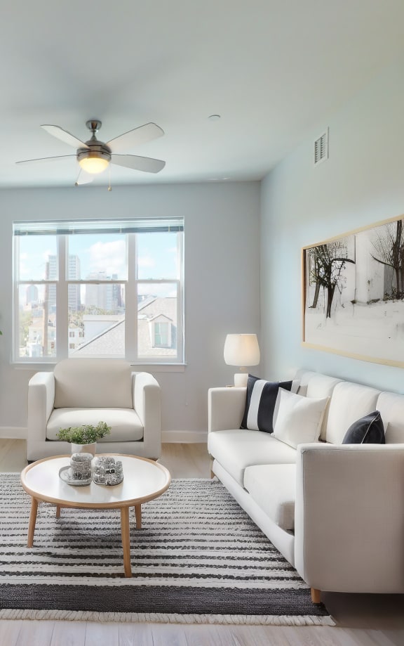 a living room with a white couch and a coffee table