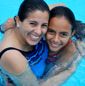 two young women in a swimming pool