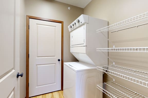 the walk in pantry and laundry space with a door to the mechanical room