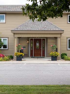 The exterior view of the clubhouse at Wilshire offers a comfortable space for residents to gather and relax.