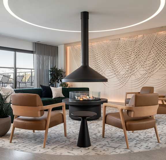 a rendering of a kitchen with a large island with two stools  at The Ansel Residences, Vadnais Heights, MN