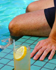 Man Sitting at the Pool with Lemonade