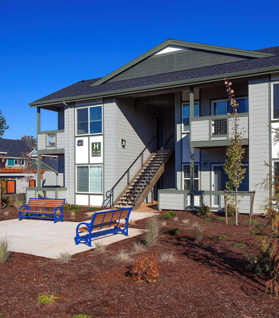 Exterior building outdoor benches at The Landing Apartments, Oregon City, OR