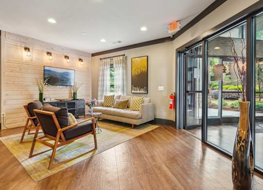 TV, couch and seats in resident lounge