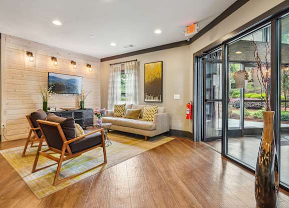 TV, couch and seats in resident lounge