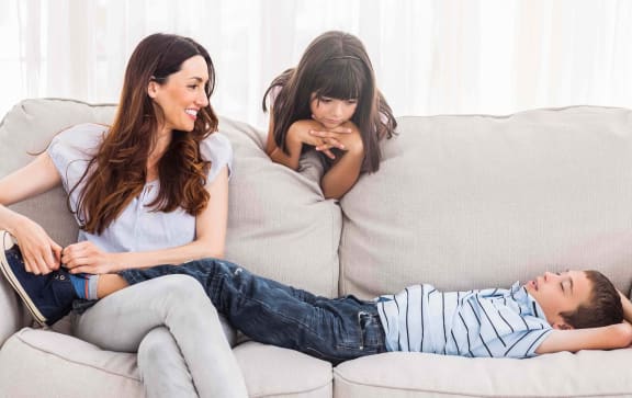 Residents relaxing in their modern apartment living room