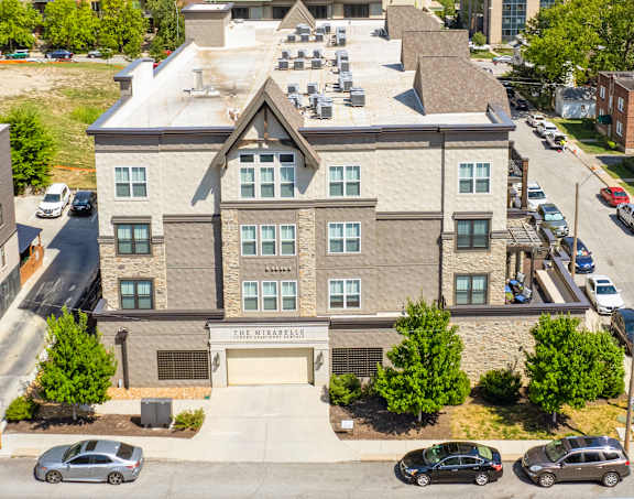 Aerial view of Mirabelle Apartments and their parking garage entrance.