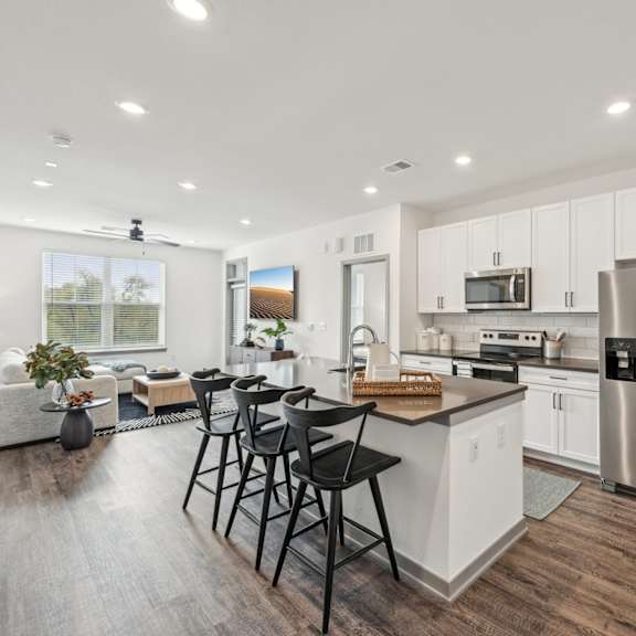 Open living room with kitchen at The Quarry Luxury Apartment Homes, Fort Collins, CO, 80526