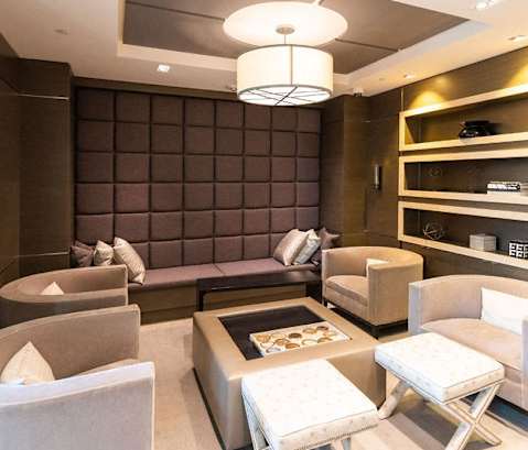 a living room with couches and chairs and a table