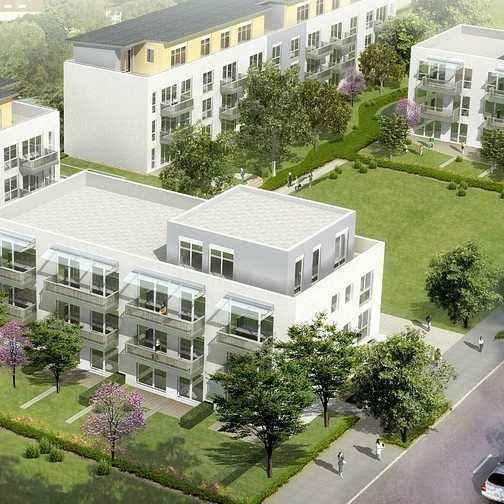 A modern building complex with a mix of white and yellow facades, surrounded by greenery and a clear sky.