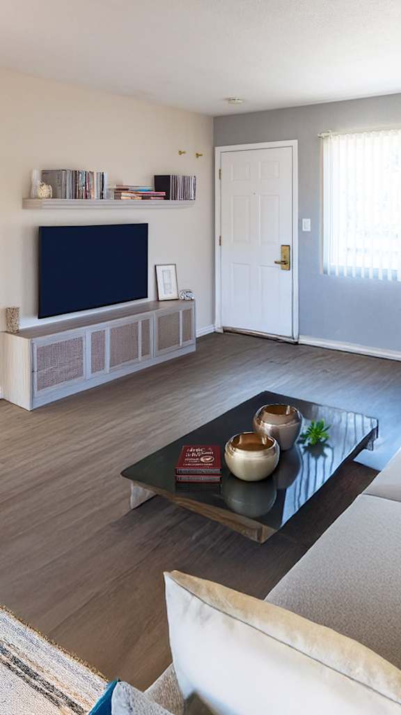 a living room with couches and a coffee table