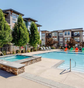 the preserve at ballantyne commons pool and spa with apartment buildings