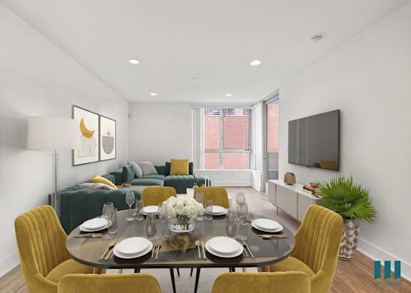 a dining area with yellow chairs and a round dining table