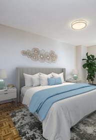 a bedroom with a large bed and a couch