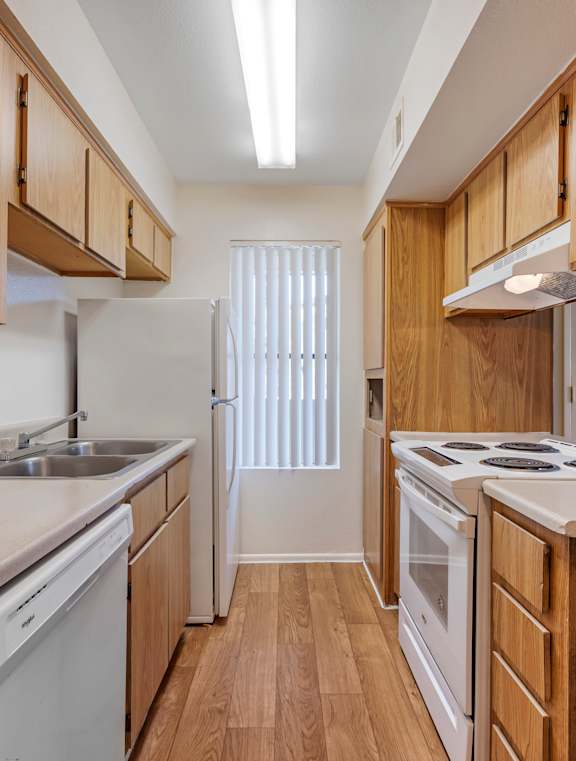 Kitchen with White Appliances at Glen Oaks