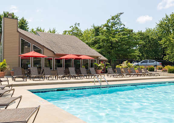 A spacious pool and lounge area at Skyler Ridge Apartments, ideal for enjoying the outdoors with comfort.