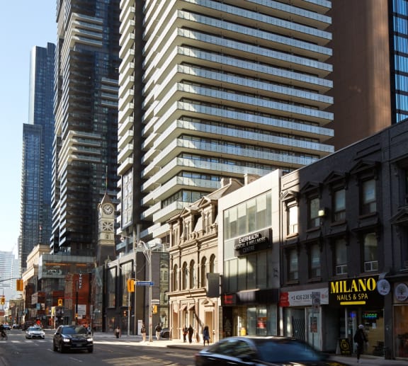 a view of a tall building on a city street