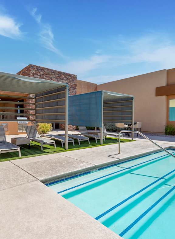 our apartments have a large swimming pool with lounge chairs at Pima Canyon, Tucson, Arizona