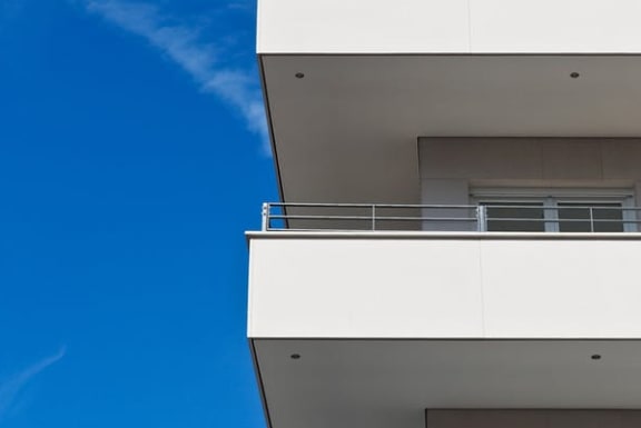 a white building with a blue sky in the background