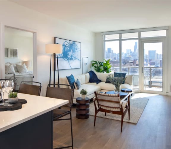 Spacious Living Room with a Oversized Windows Overlooking Chicago at North+Vine in Illinois, 60610