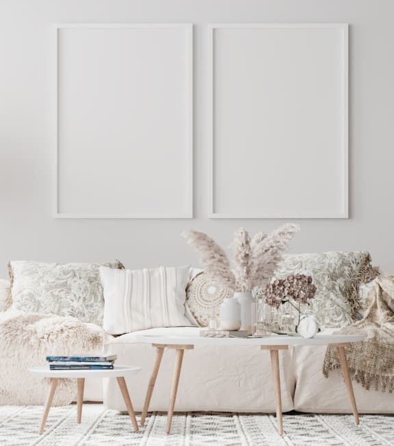 a white living room with a white couch and pillows at Connect on Missouri, Phoenix, AZ