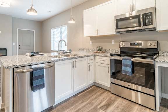 Kitchen with white cabinets and stainless steel appliances