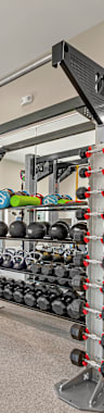 A spacious home gym with a variety of equipment.