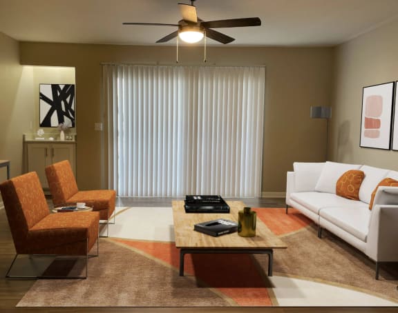 a living room with a white couch and a coffee table