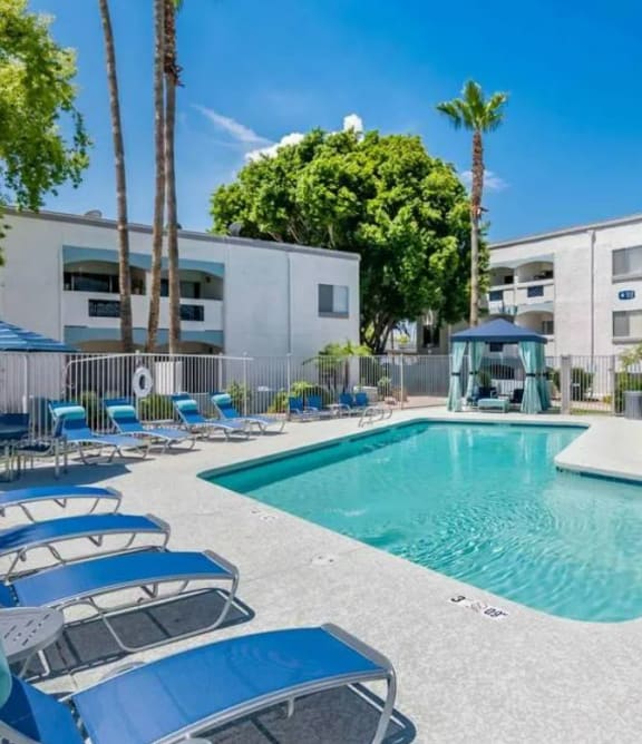 a resort style pool with chaise lounge chairs and a gazebo  at Sofia Apartments, Tempe, AZ, 85283
