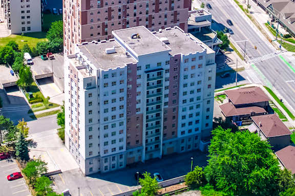 A cityscape with a mix of residential and commercial buildings.