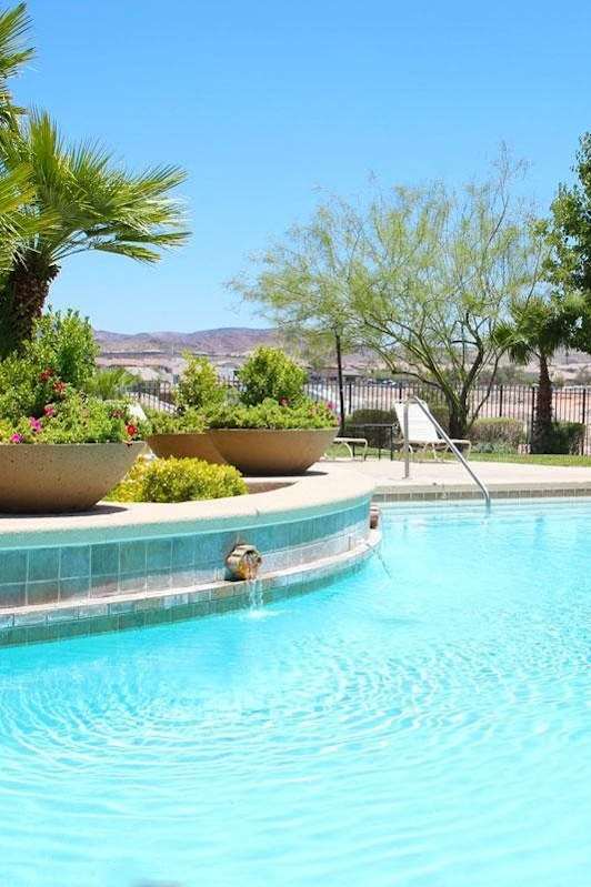 A pool surrounded by palm trees and a gazebo at Avalon at Seven Hills Apartments, Henderson, NV, 91790