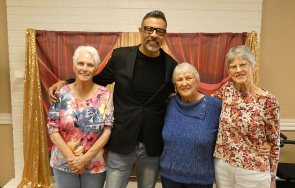 a group of people posing for a picture