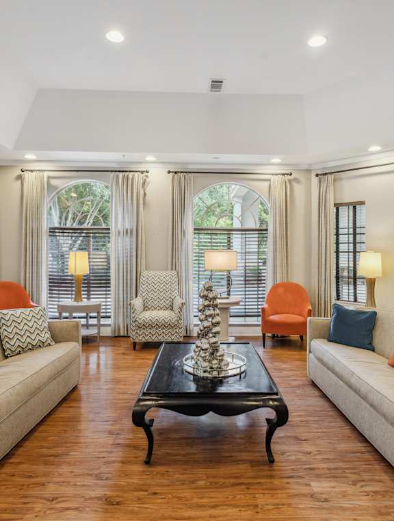 A living room with a fireplace and a coffee table.