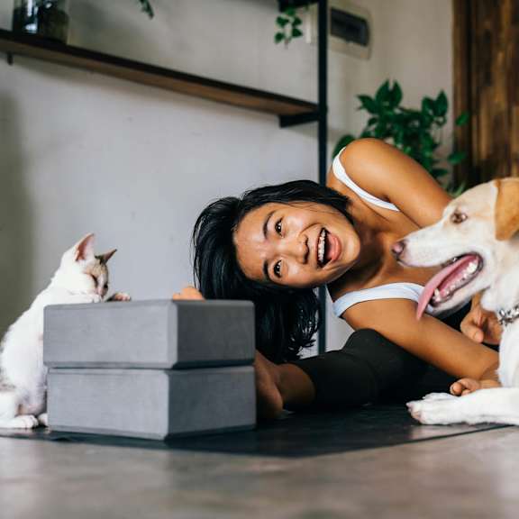 Woman Playing with a Dog and a Cat at Millennium at Creve Coeur, Creve Coeur, 63141