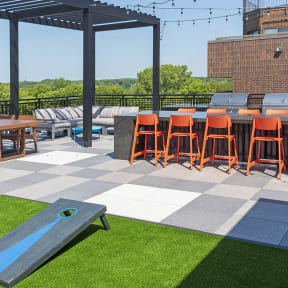 an outdoor patio with a bar and picnic table