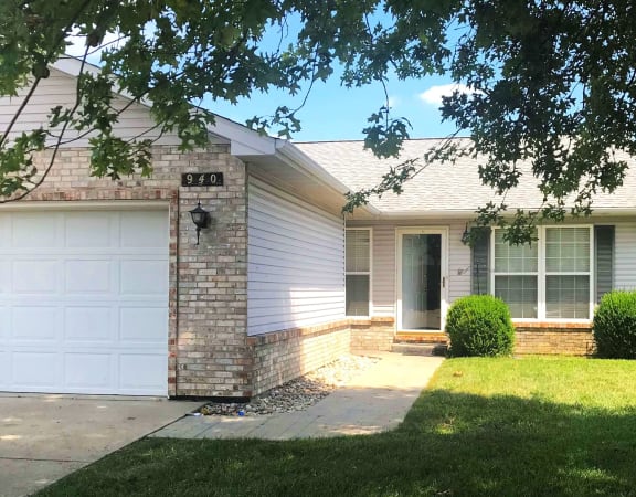 a white house with a white garage door